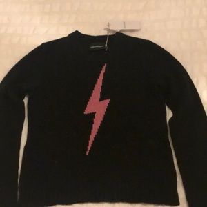Black cashmere sweater with pink lightning bolt